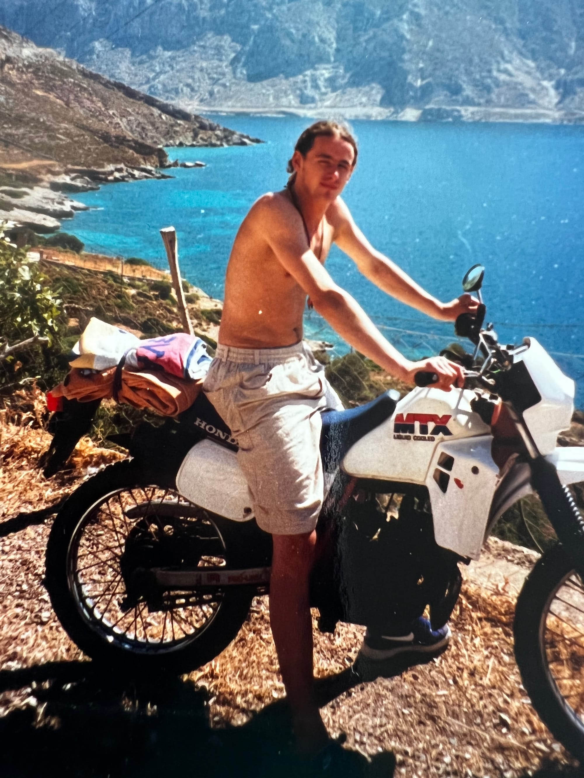 A 17-year-old Ed on a Honda MTX200 in Greece, marking the start of a 40-year journey from international off-road riding to adventure touring in Far North Queensland