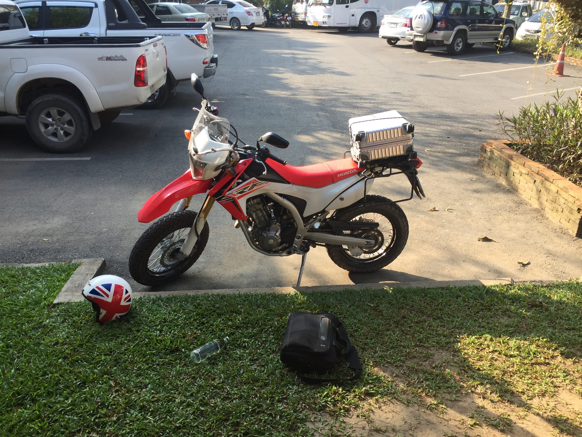 A Honda CRF300 dual-sport motorcycle parked near the Chinese border in North Vietnam during a solo touring expedition.