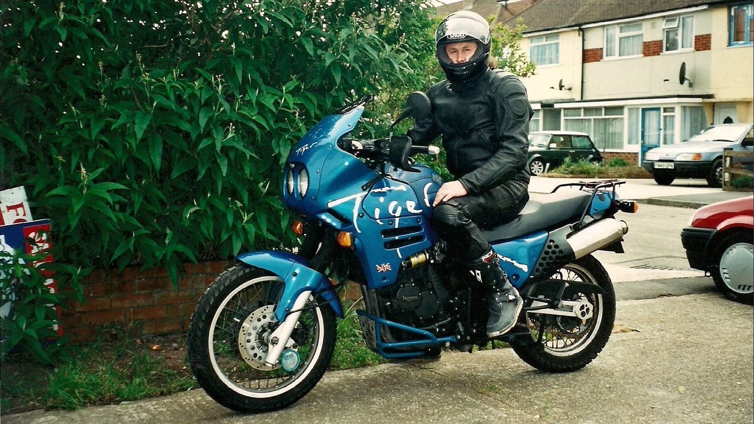 A 1990s Triumph Tiger 900 adventure motorcycle.